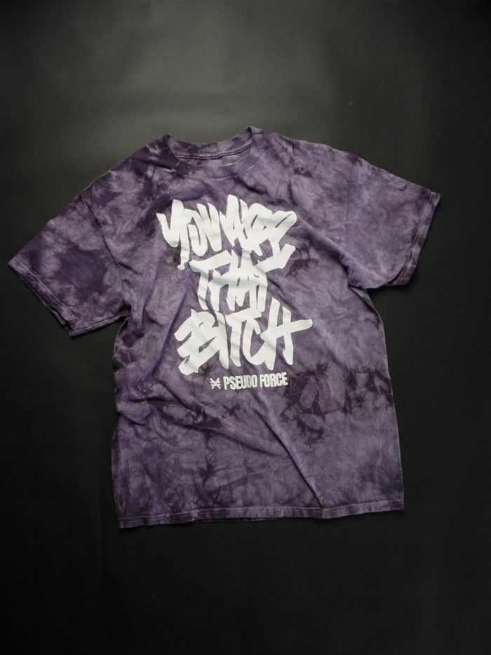 Purple tie-dye t-shirt with white text on a black background