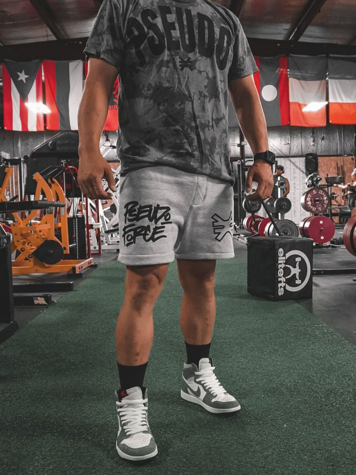 black bleached t shirt Pseudo Force in a powerlifting gym.