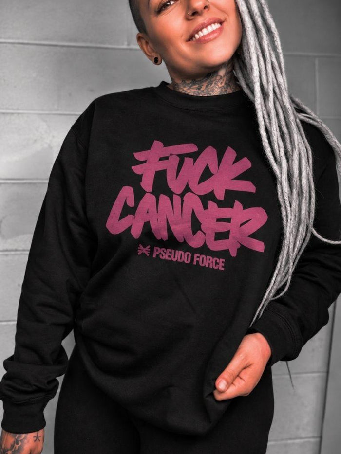 woman wearing black crewneck sweater that says fuck cancer in pink.