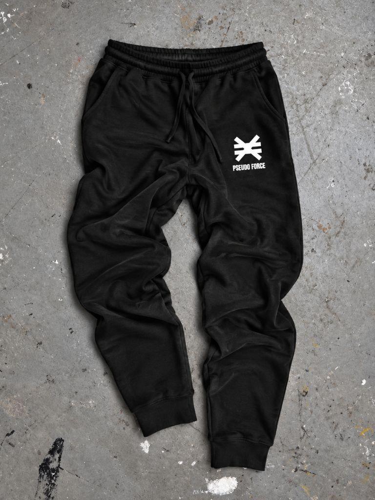 black sweatpants on cement background with white pseudo force logo on left leg near pocket.